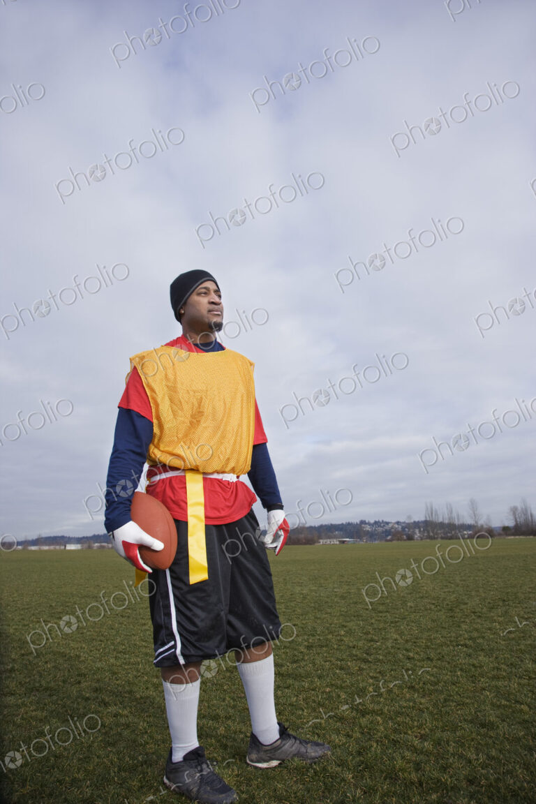 Black man, a member of an Americn flag football team.