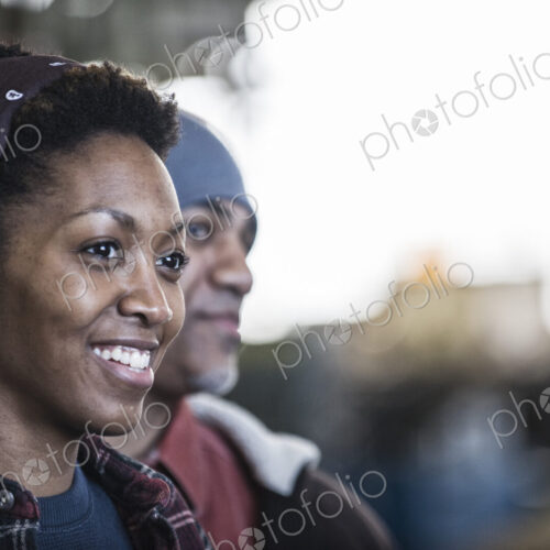 Black man and woman team of factory workers in a sheet metal factory Black man and woman team of factory workers in a sheet metal factory