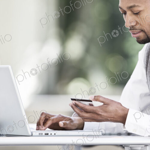 Black man business person in a business center. Black man business person in a business center.