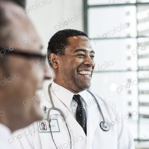 Black man doctor in lab coat with a stethescope.