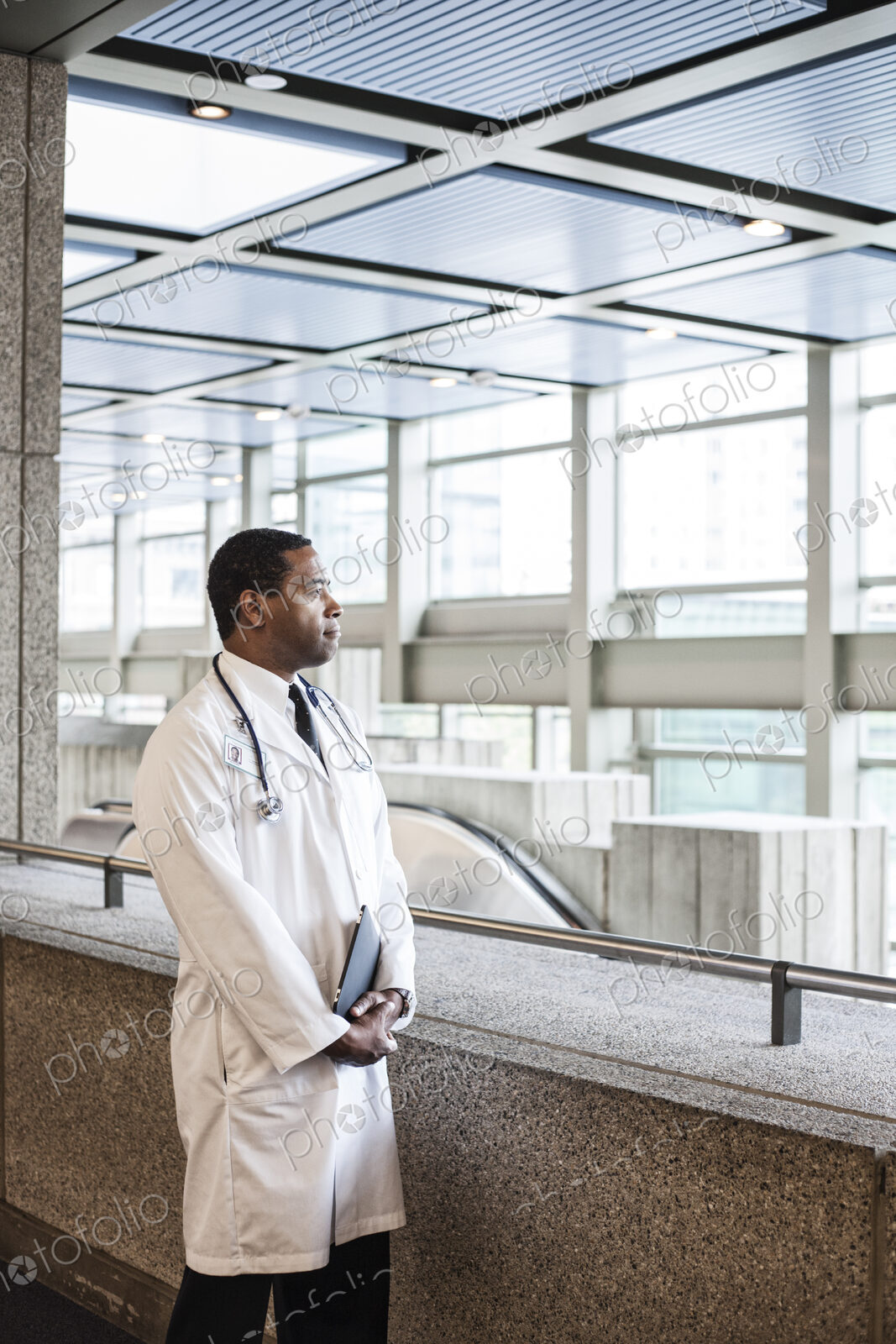 Black man doctor in lab coat with a stethescope.