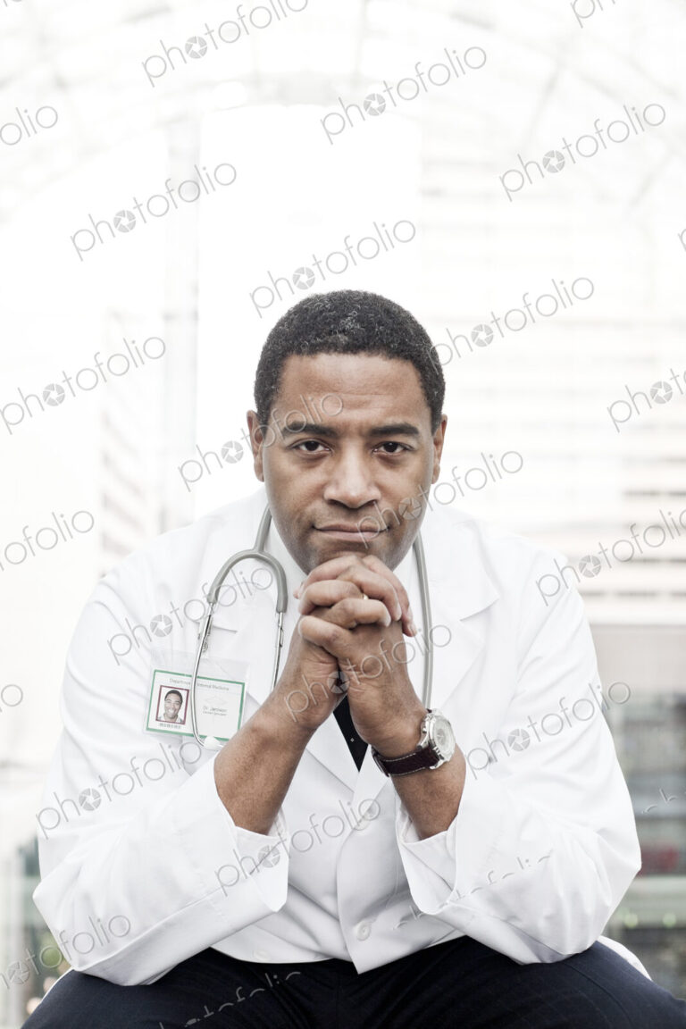 Black man doctor in lab coat with a stethescope.