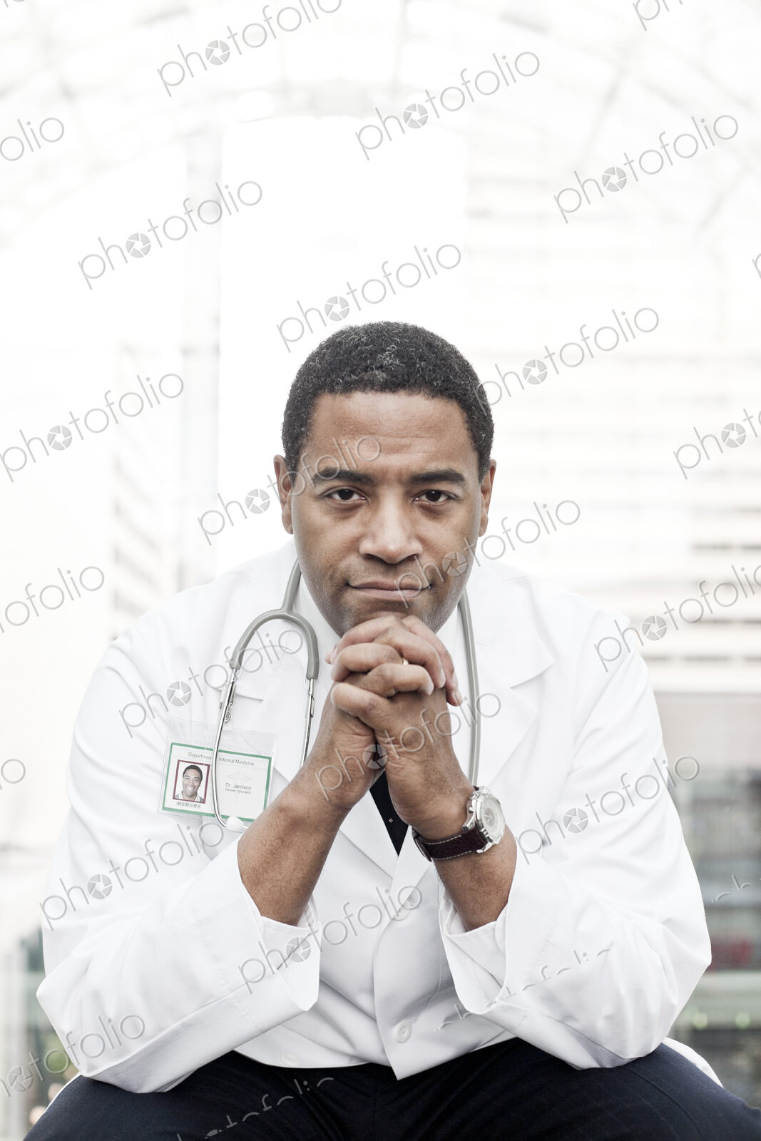 Black man doctor in lab coat with a stethescope.