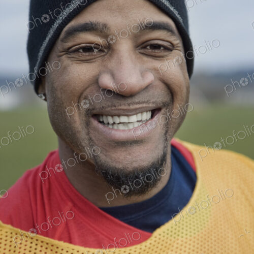 Black man in sports vest and woolly hat, member of a weekend sports team in the winter. Black man in sports vest and woolly hat, member of a weekend sports team in the winter.