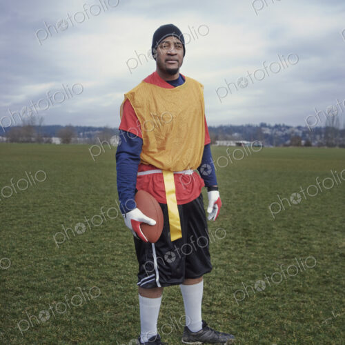 Black man member of an American flag football team.