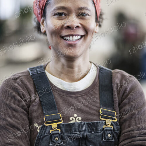 Black woman factory worker in a sheet metal factory. Black woman factory worker in a sheet metal factory.