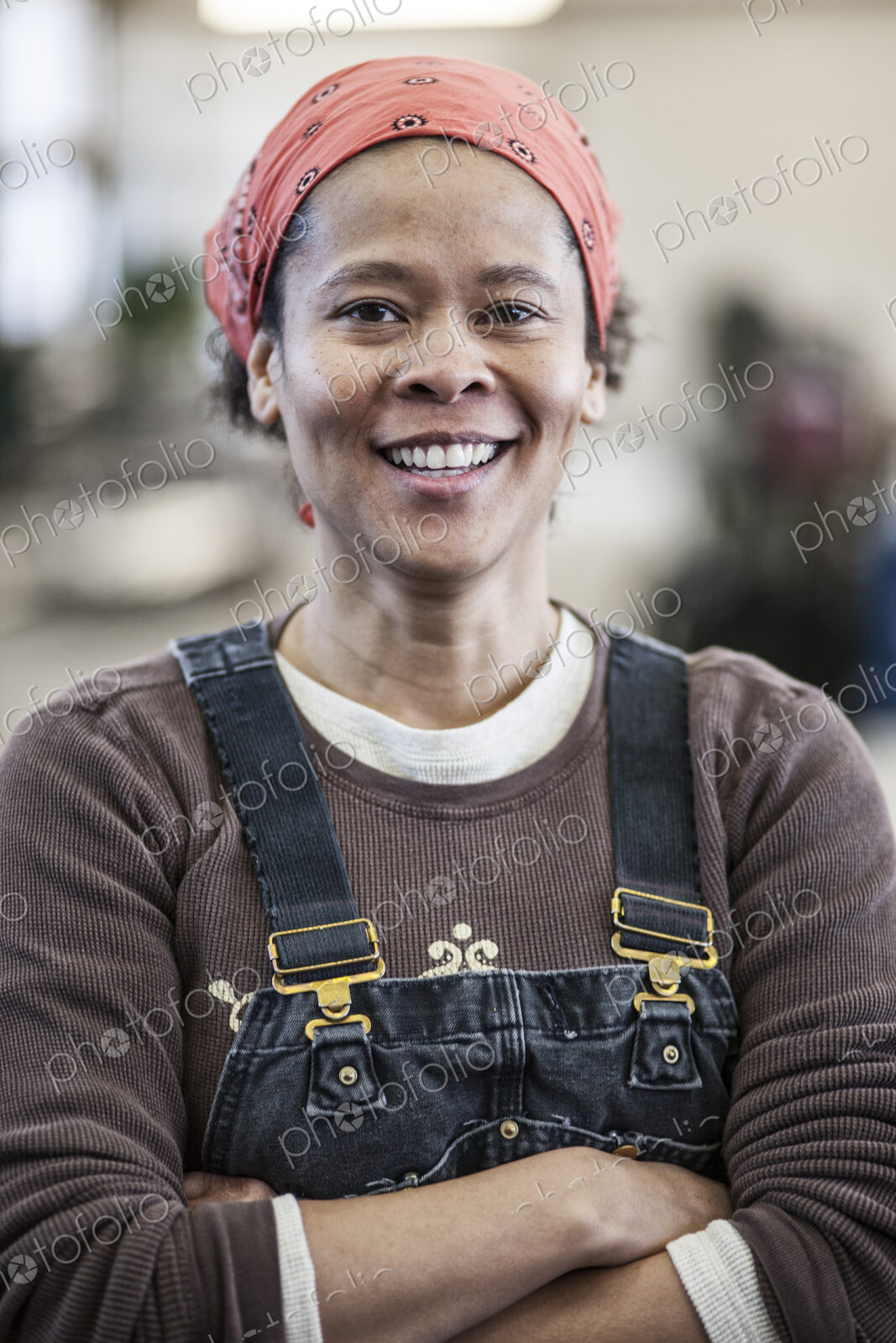 Black woman factory worker in a sheet metal factory.