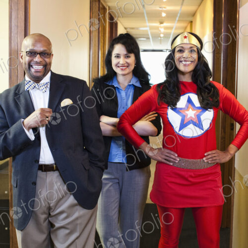 Black woman super hero and her team of mixed race office employees. Black woman super hero and her team of mixed race office employees.