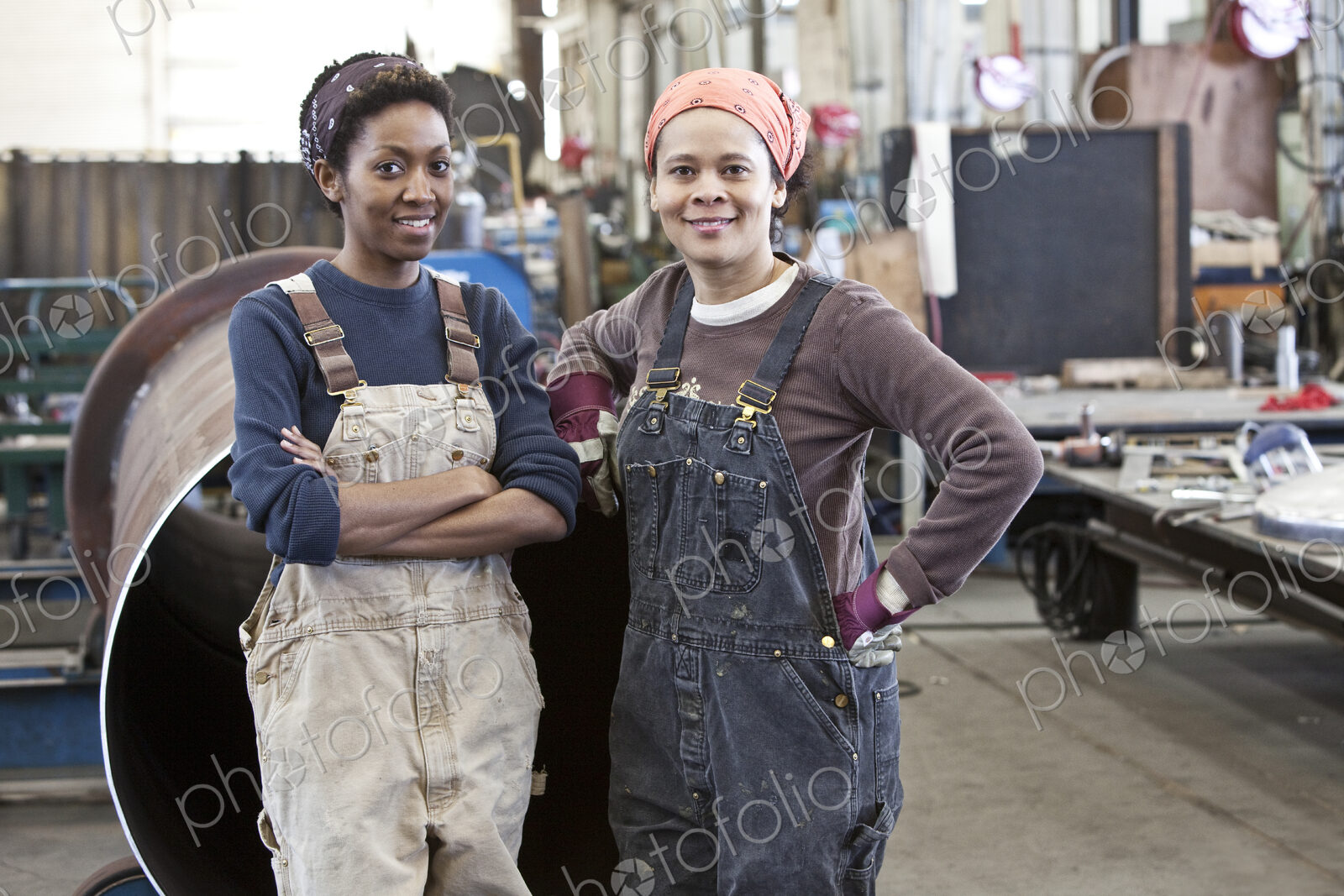 Black women team of factory workers in a sheet metal factory.