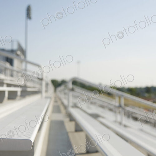 Bleachers, staggered stadium seats at a sports field.