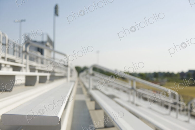 Bleachers, staggered stadium seats at a sports field.