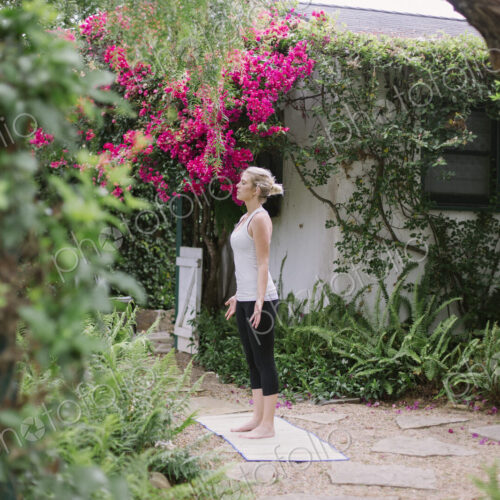 Blond woman doing yoga in a garden. Blond woman doing yoga in a garden.