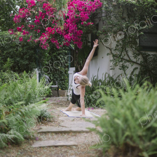 Blond woman doing yoga in a garden. Blond woman doing yoga in a garden.