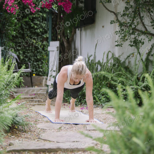 Blond woman doing yoga in a garden. Blond woman doing yoga in a garden.