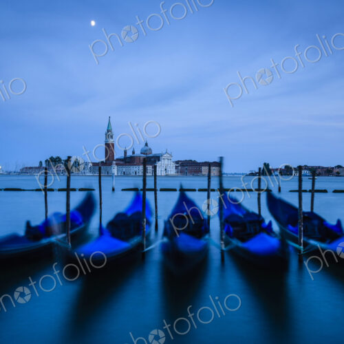 Blue gondolas at night