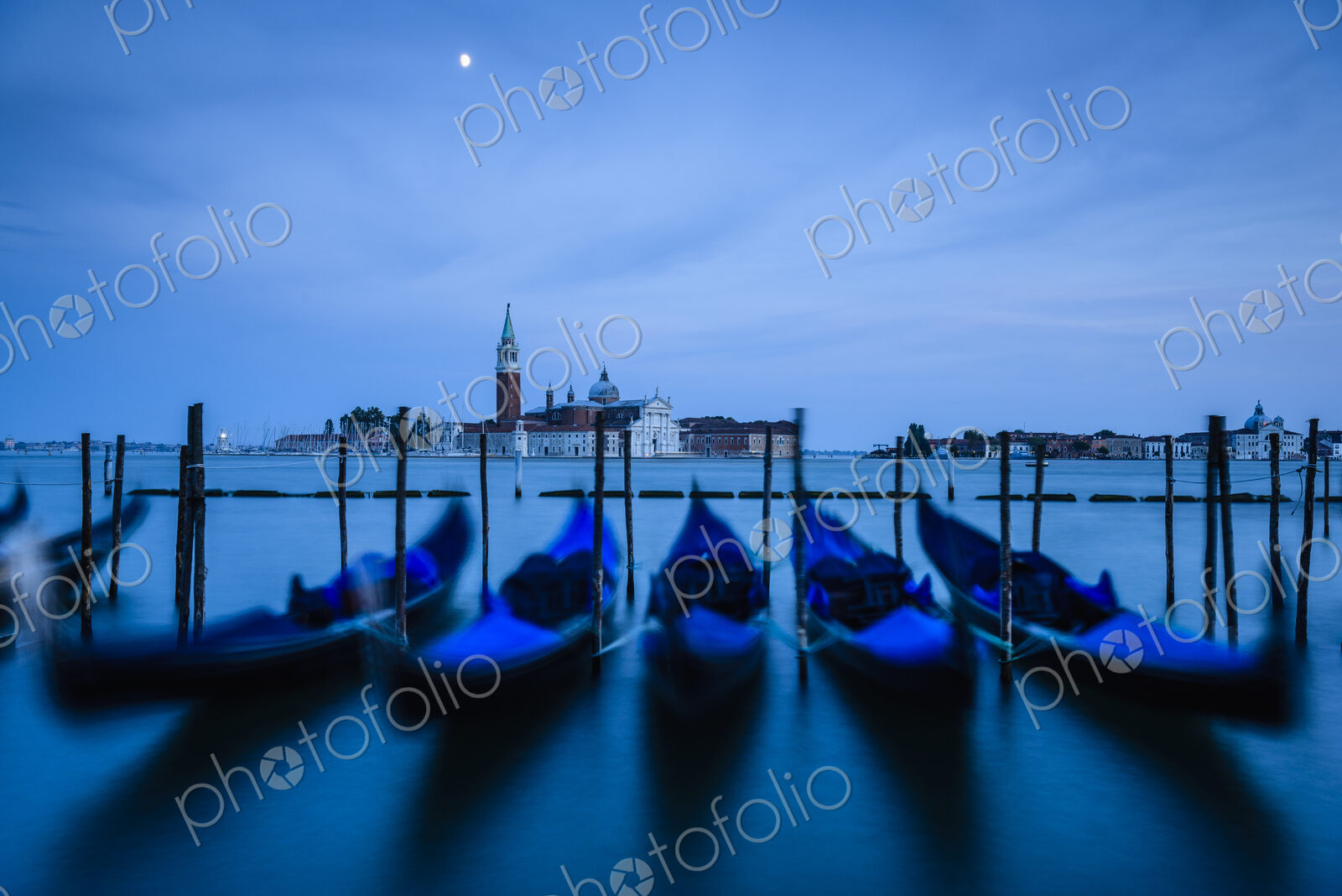 Blue gondolas at night