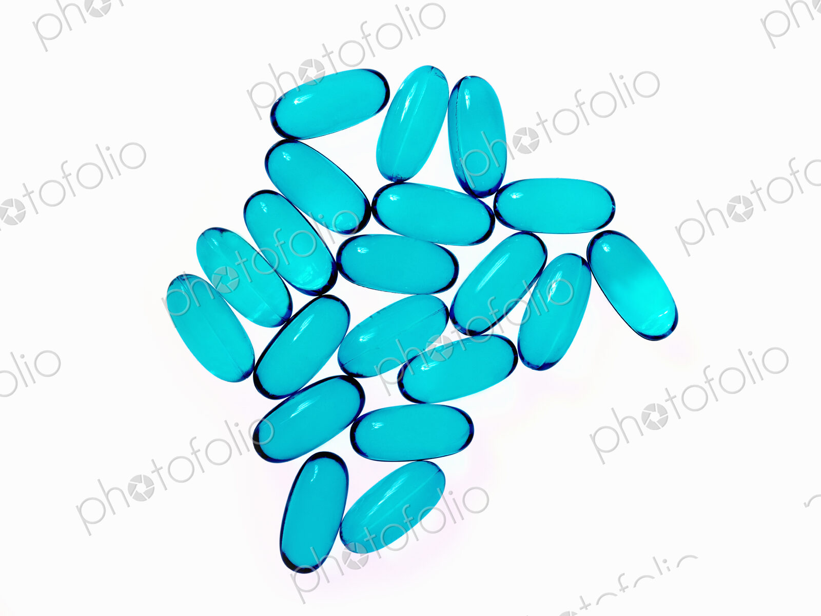 Blue oblong gel pill capsules. Arranged in a pattern.
