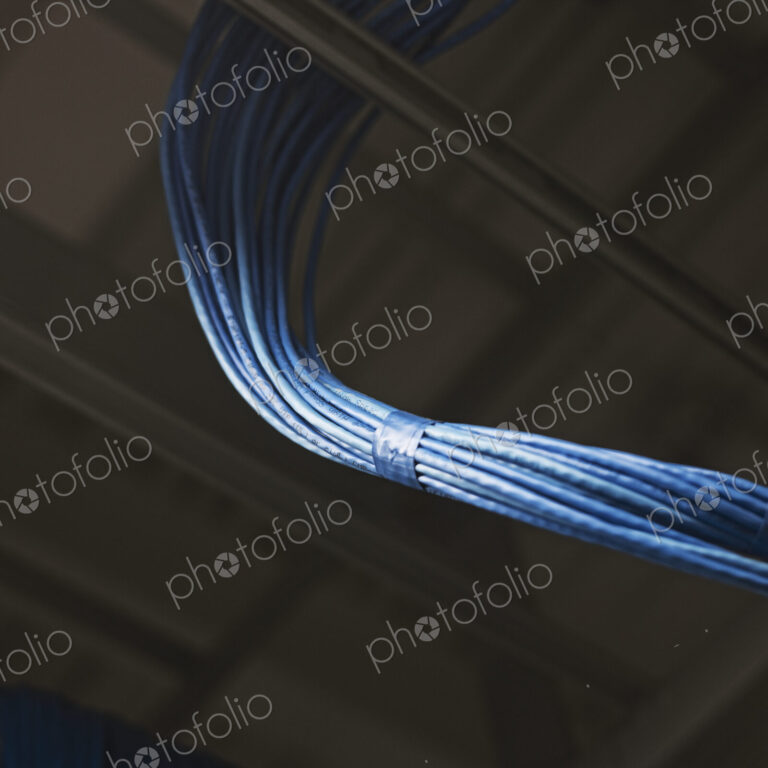 Blue power cables in server room.