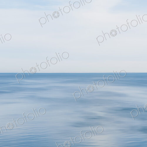 Blue seascape abstract, view over calm water, graduated colours of the sea.