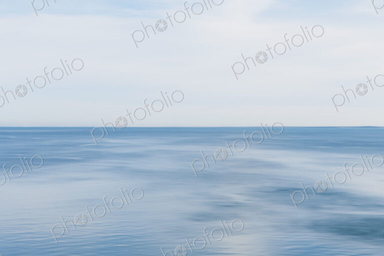 Blue seascape abstract, view over calm water, graduated colours of the sea.