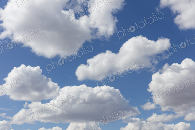Blue sky and small cumulus clouds in the sky.