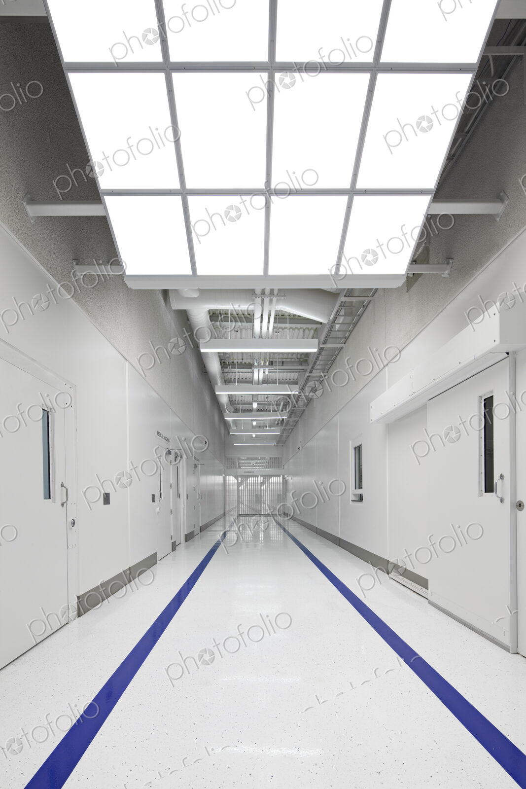 Blue stripes on jail corridor