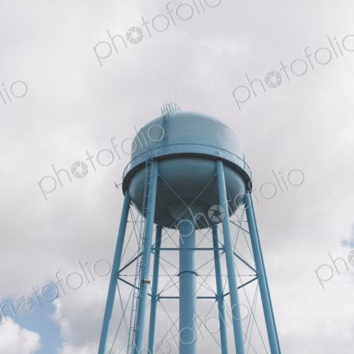 Blue water tower, sky and clouds in background, Saskatchewan, Canada.