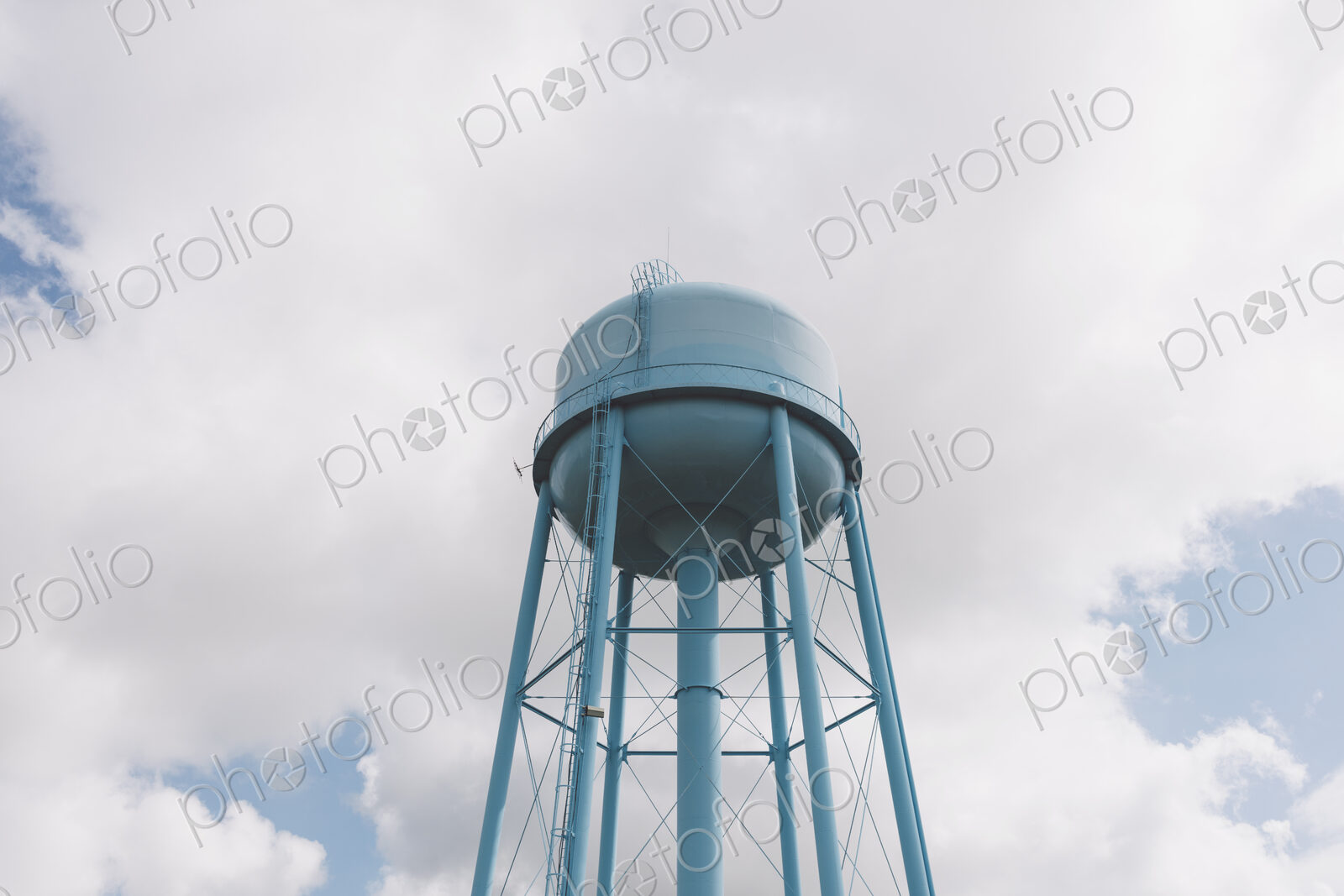 Blue water tower, sky and clouds in background, Saskatchewan, Canada.