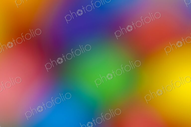 Blurred close-up of multicolored gumballs creating a soft, vibrant background. Ideal…