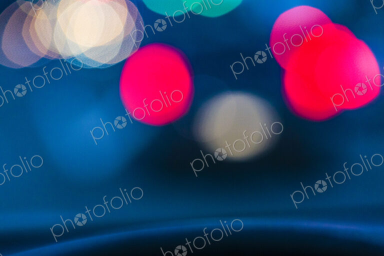 Blurred tail lights in urban road scene at night, Seattle