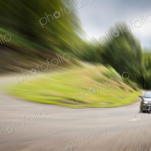 Blurred view of car driving on curved road Blurred view of car driving on curved road