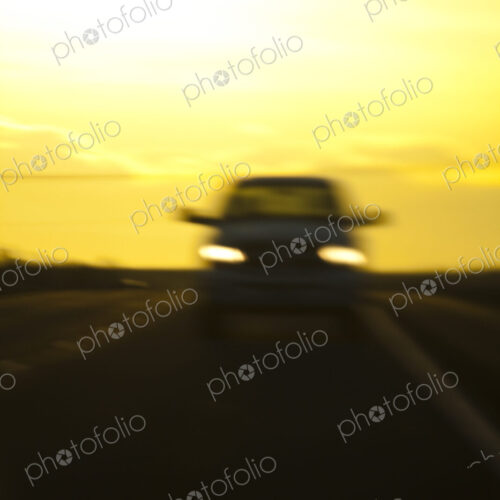 Blurred view of car on road at night Blurred view of car on road at night