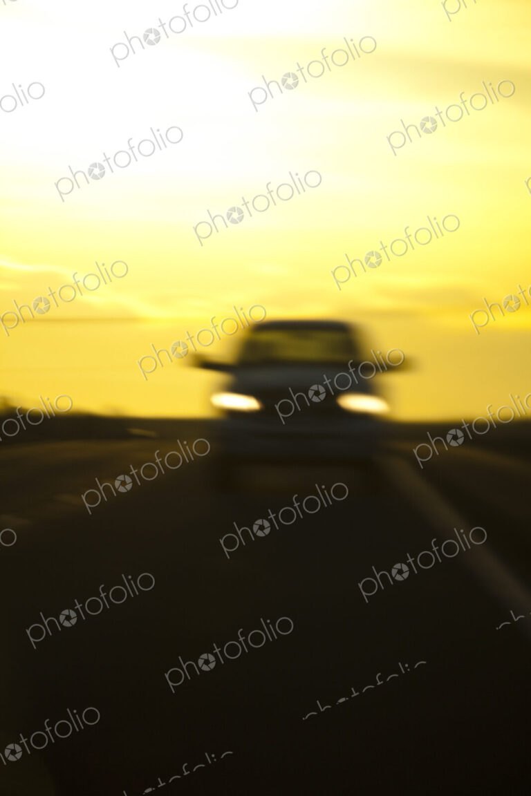 Blurred view of car on road at night