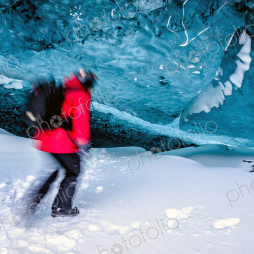 Blurred view of hiker walking in ice cave