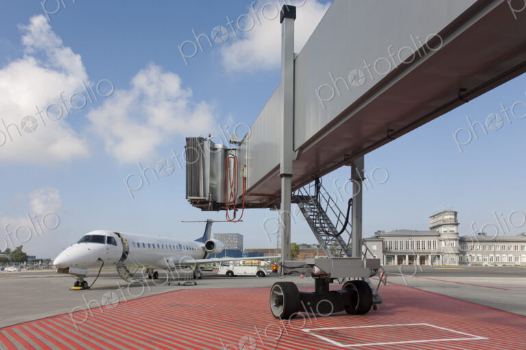 Boarding Bridge Leading to a Parked Plane