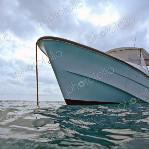 Boat Anchored In Water Boat Anchored In Water
