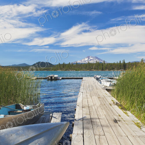 Boat moored along pier, Davis Lake, Bend, Oregon, United States Boat moored along pier, Davis Lake, Bend, Oregon, United States