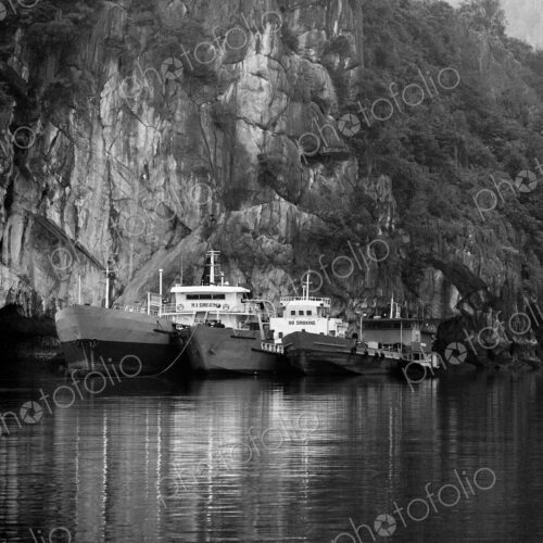 Boats Docked by a Cliff Boats Docked by a Cliff