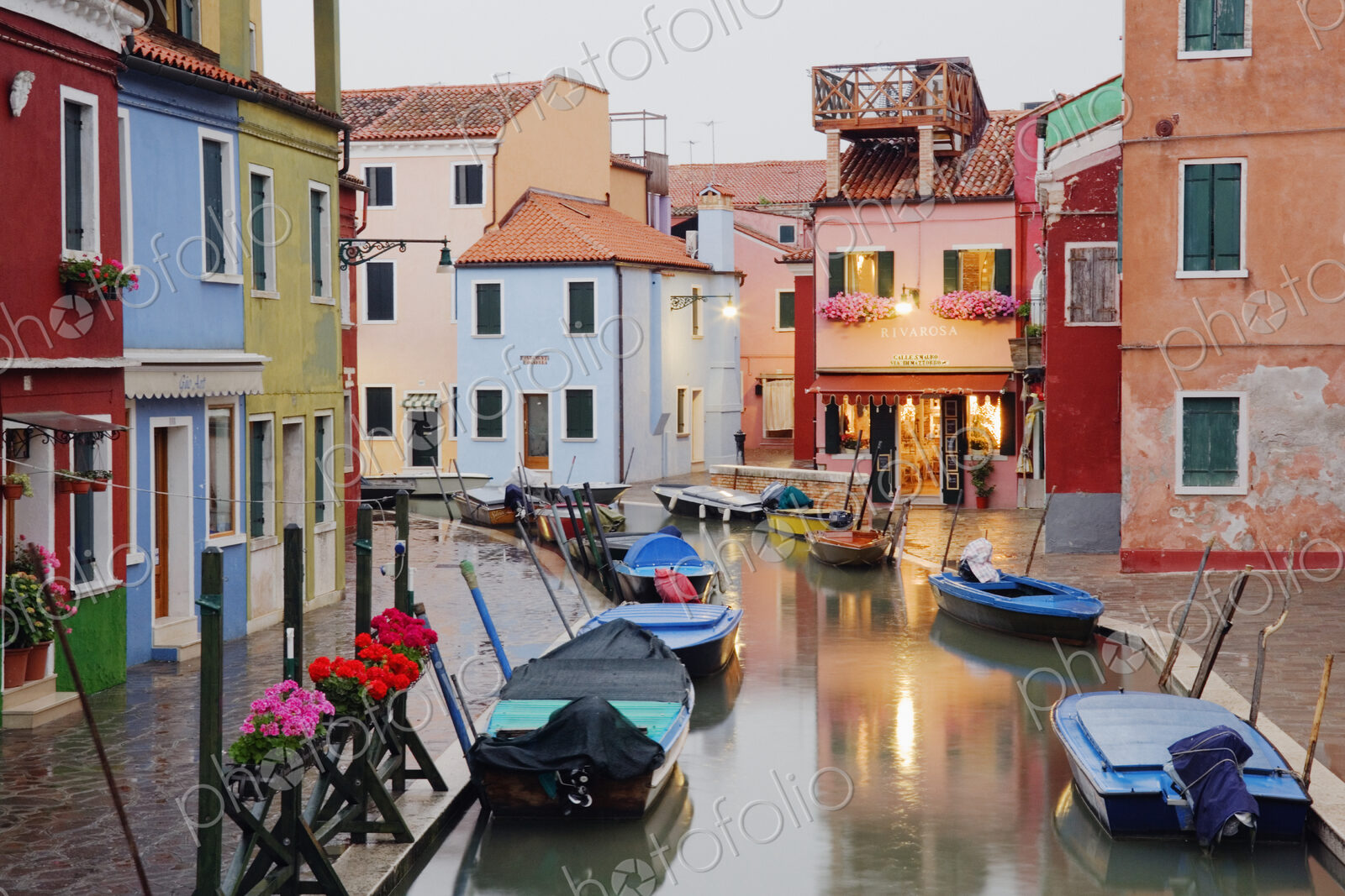 Boats in Burano Canal During a Rain Shower