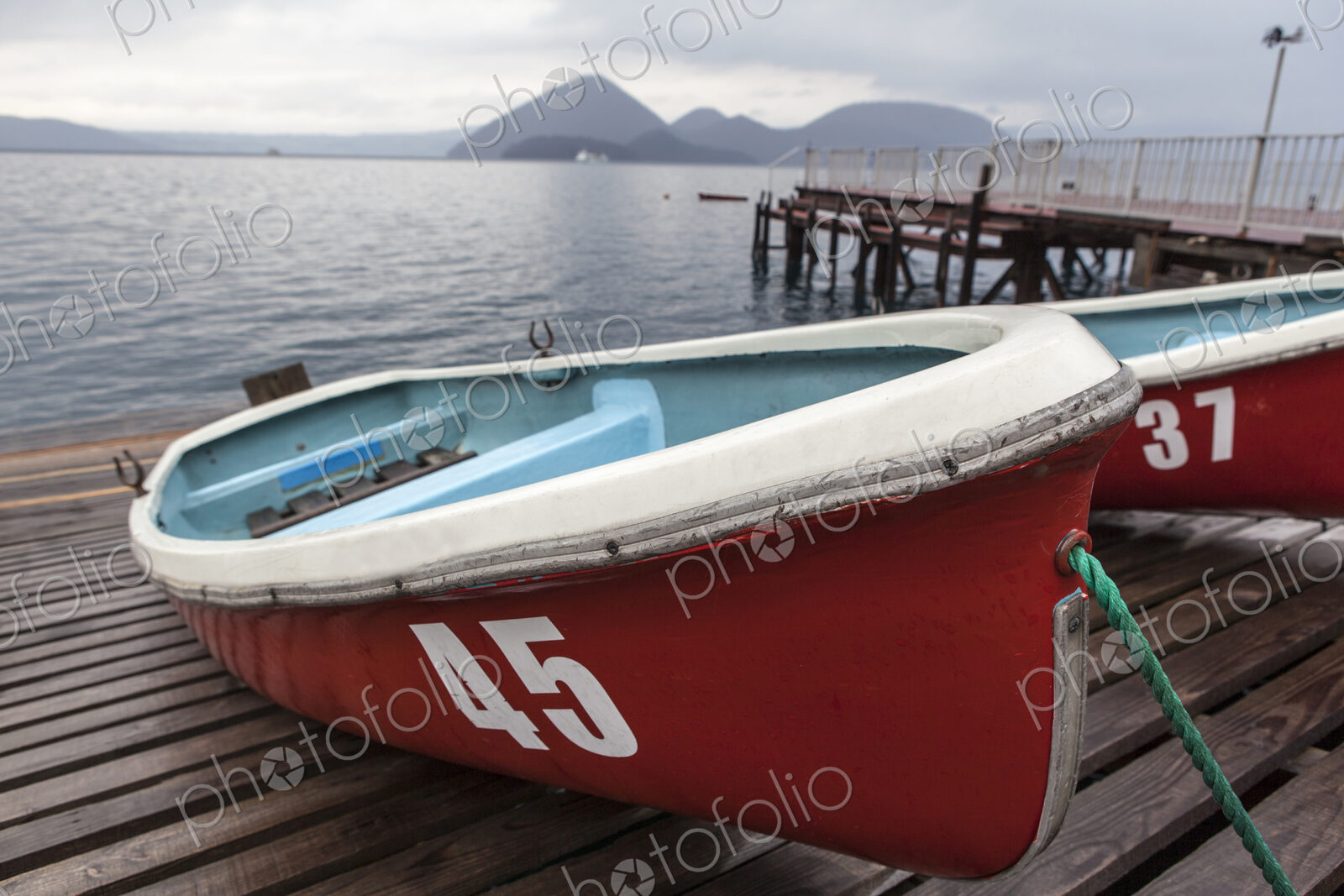 Boats on wooden dock