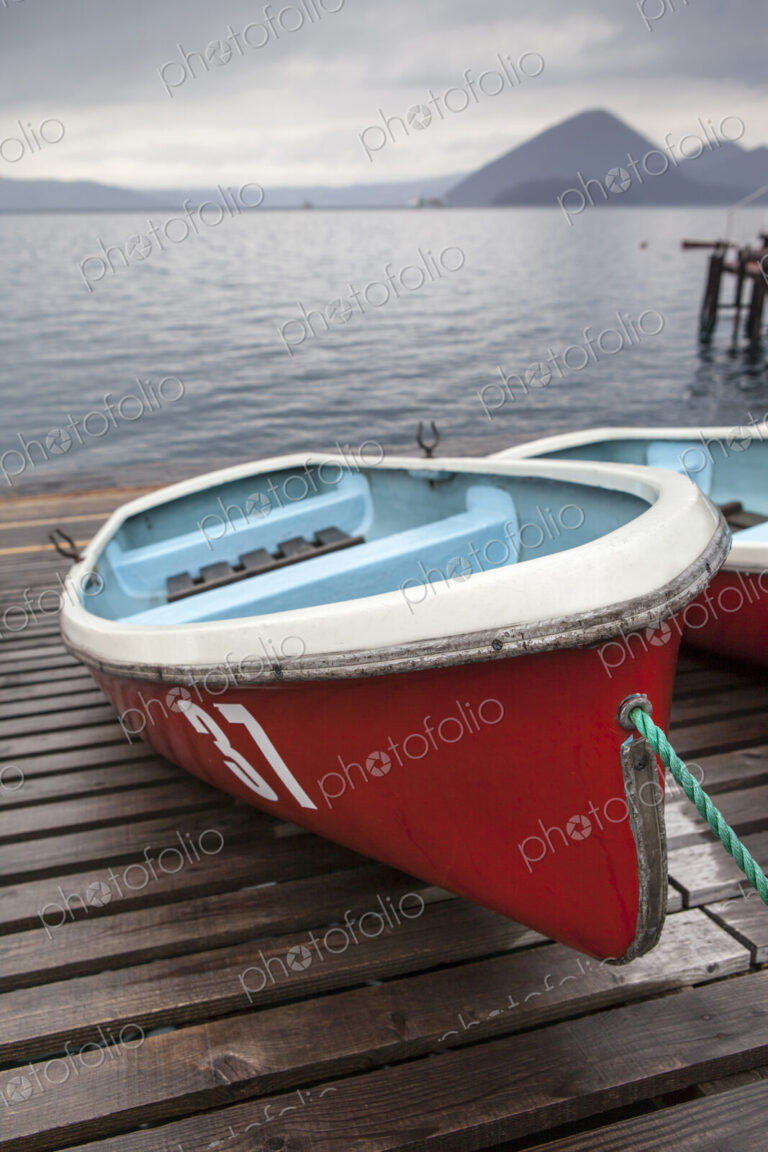 Boats on wooden dock