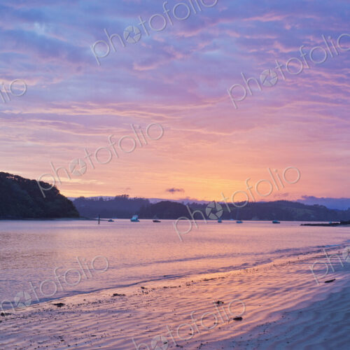 Boats sailing in bay at sunrise, Bay of Islands, Paihia, New Zealand Boats sailing in bay at sunrise, Bay of Islands, Paihia, New Zealand