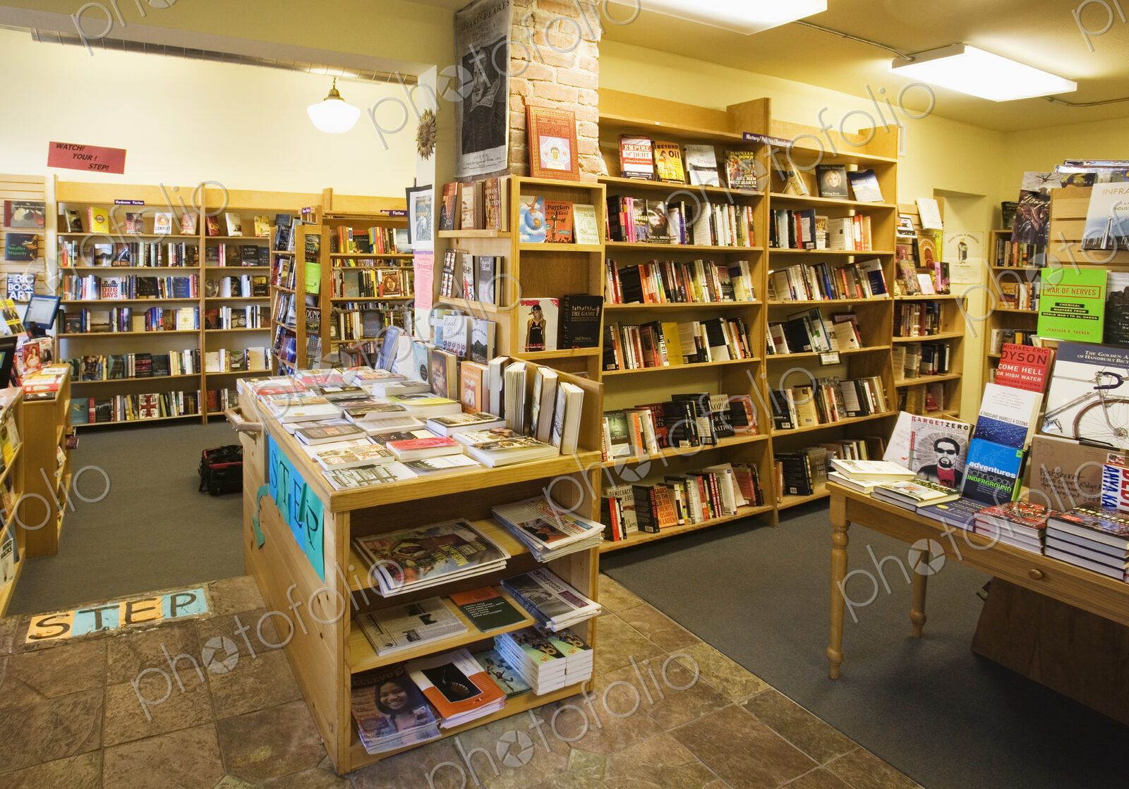 Books on shelves and tables in bookstore
