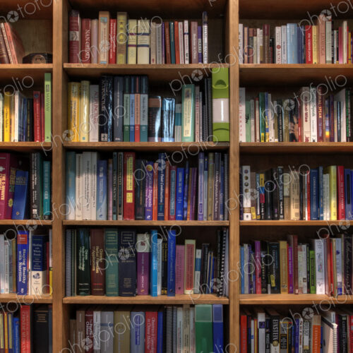 Books organized in bookshelves Books organized in bookshelves