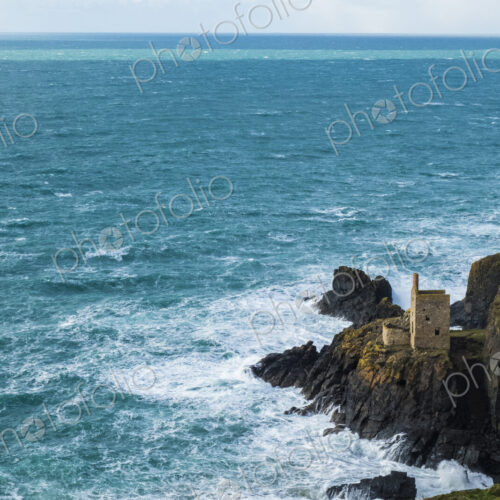 Botallack Crown Mines, view down onto ruined mine workings and wheel house on the… Botallack Crown Mines, view down onto ruined mine workings and wheel house on the…
