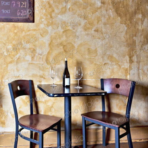 Bottle of wine and glasses on table in wine bar Bottle of wine and glasses on table in wine bar
