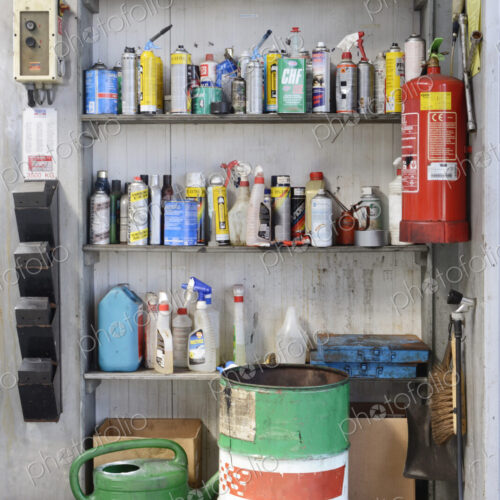 Bottles of liquids on shelf in auto garage shop. Bottles of liquids on shelf in auto garage shop.