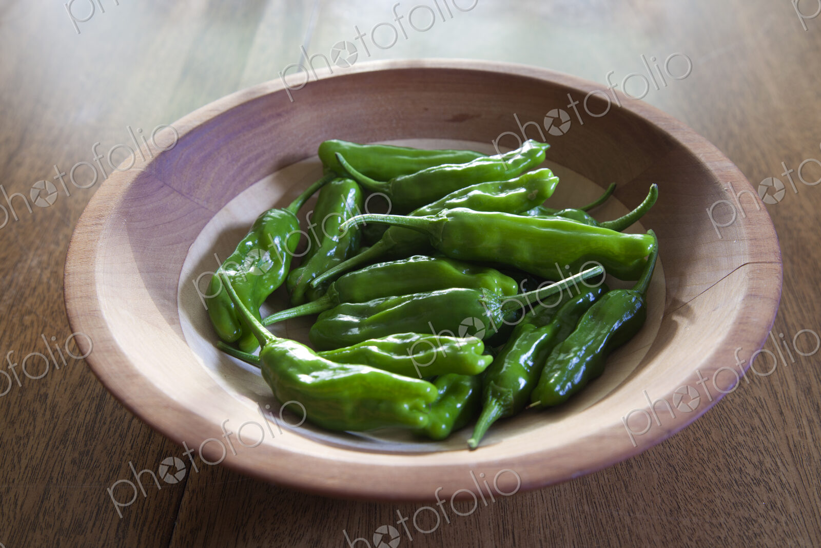 Bowl of green shishito peppers