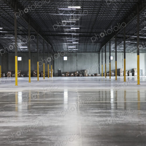 Boxes along wall in distance in warehouse Boxes along wall in distance in warehouse