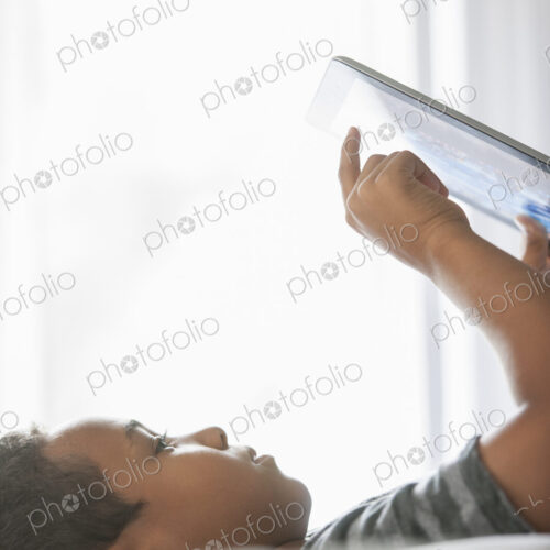 Boy using a tablet. Boy using a tablet.